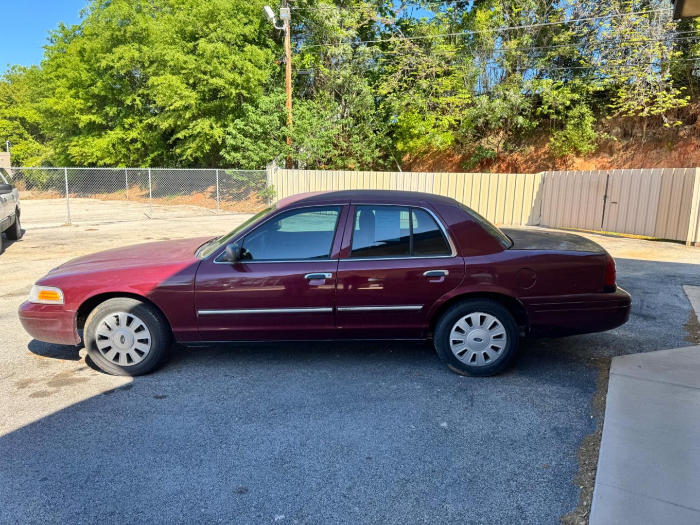 2011 Maroon Ford Crown Victoria (2FABP7BV8BX) , located at 307 West Marshall Avenue, Longview, TX, 75601, (903) 753-3091, 32.500828, -94.742577 - Photo#2